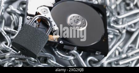 Data on cd rom secured with chain and padlock equipment, key hole Stock Photo