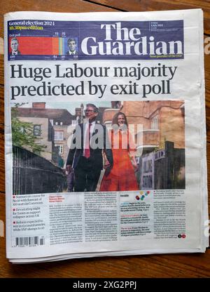 'Huge Labour majority predicted by exit poll' Guardian newspaper headline front page 5 July 2024 Keir Starmer PM article London England UK Britain Stock Photo