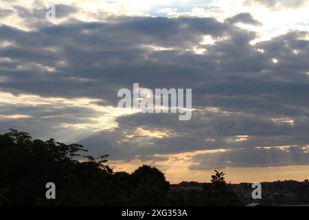 Golden hour before sunset clouds grey sky Stock Photo