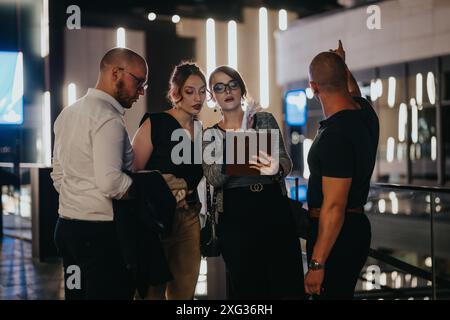 Business team having a discussion at night in a modern office building Stock Photo