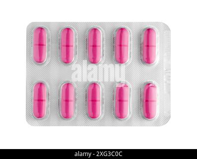Red medication pills in a blister pack isolated on white background, top view closeup, healthcare and medicine object Stock Photo