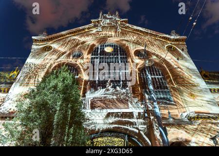 Budapest, Hungary - May 04, 2024: Light show on the Central Market building. Anniversary of accession to the European Union. Stock Photo