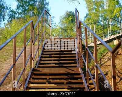 Iron staircase descending to the river, Russia Stock Photo