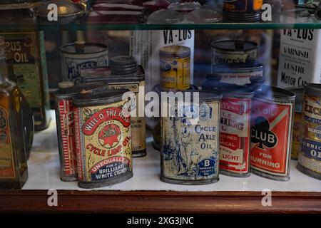 Beamish museum. Durham, UK. Oil and petroleom containers in 1920's garage. Stock Photo