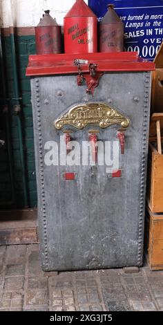 Beamish museum. Durham, UK. Oil and petroleom containers in 1920's garage. Stock Photo