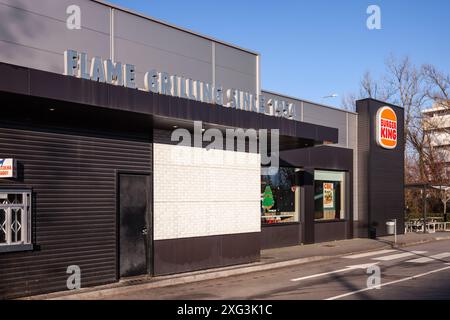 Famalicao, Portugal: Burger King fast food franchise restaurant with slogan Flame Grilling Since 1954. Hamburger fast food meal Stock Photo