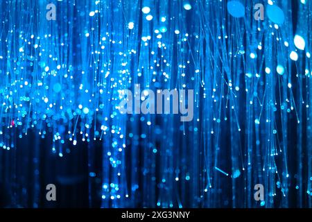 blue fiber optic background with lots of light and bokeh Stock Photo