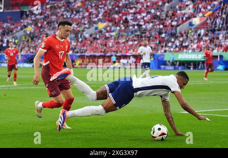 England’s Ezri Konsa is fouled by Switzerland's Ruben Vargas during the UEFA Euro 2024, quarter-final match at the Dusseldorf Arena, Germany. Picture date: Saturday July 6, 2024. Stock Photo