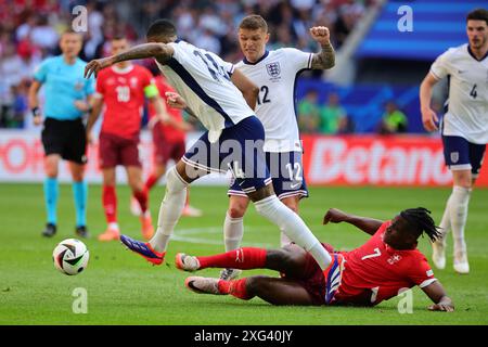 Dusseldorf, Germany. 06th July, 2024. Ezri Konsa of England and Breel Embolo of Switzerland compete for the ball during the Euro 2024 Quarter-finals football match between England and Switzerland at Dusseldorf Arena Stadium in Dusseldorf (Germany), July 6th, 2024. Credit: Insidefoto di andrea staccioli/Alamy Live News Stock Photo