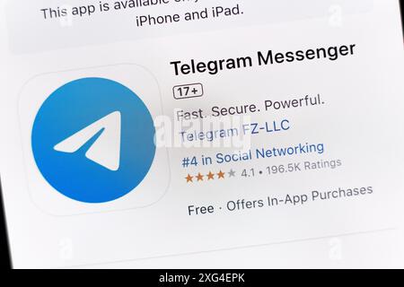 In this photo illustration, the Telegram Messenger app is seen on the Apple Store download page on the smartphone screen. Stock Photo