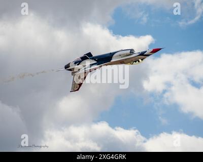 The incredible United States Air Force flight demonstration team, the Thunderbirds, flies their precision routine during an airshow. Stock Photo