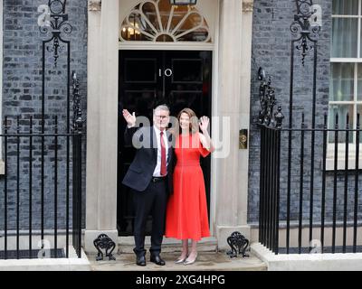 London, UK. 5th July, 2024. Newly appointed Prime Minister Sir Keir Starmer arrives at No 10 with his wife Victoria after his meeting with the King. Stock Photo