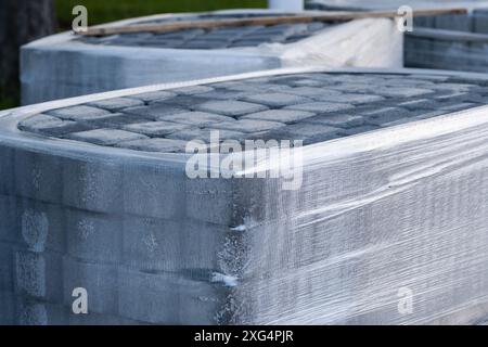 Stack of concrete blocks on construction site, closeup Stock Photo