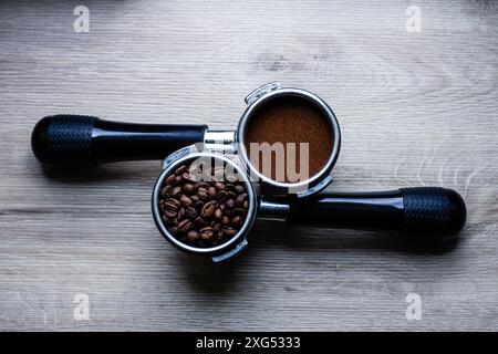 a cup of coffee a coffee horn with natural ground coffee and temper on a white background close-up, selective focus Stock Photo