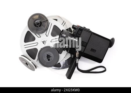 Vintage super 8 camera and film reels isolated on white background. Movie film background Stock Photo