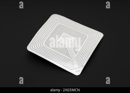 RFID tag isolated on black background. Radio frequency identification Stock Photo