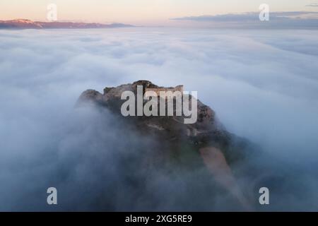 Aerial view of a medieval Castle in a beautiful foggy sunset, Poza de la sal, Burgos, Spain. High quality photography Stock Photo