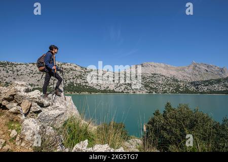 Lonely hiker watching the Puig Major, 1436 mts, Cuber Reservoir, Fornalutx, Majorca, Balearic Islands, Spain Stock Photo