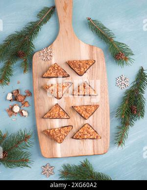 Nut corner, traditional german sweets called Nussecke, covered with chocolate, christmas baking Stock Photo