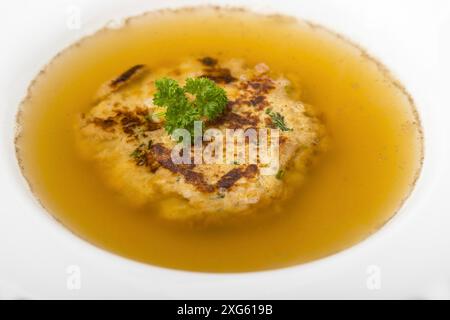 Austrian cheese dumplings in broth Stock Photo