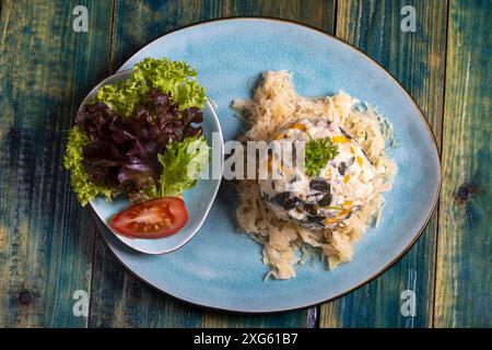 Austrian bread dumpling on sauerkraut Stock Photo