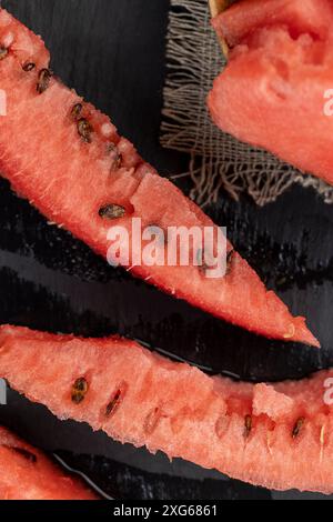 pieces of red watermelon on the table, cooking ripe red watermelon Stock Photo