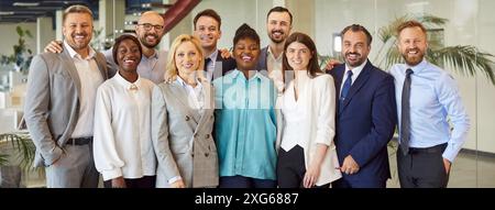 Portrait of diverse business people standing on a meeting and looking at the camera. Stock Photo