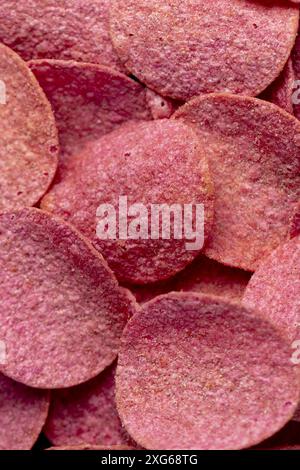 red potato chips with meat flavor, adding red dye to potato chips Stock Photo