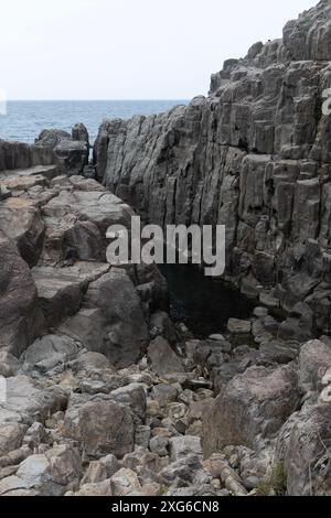 Tojinbo (東尋坊, Tōjinbō) is a one kilometer long stretch of rugged basalt cliffs along the Sea of Japan coast north of Fukui City. Stock Photo