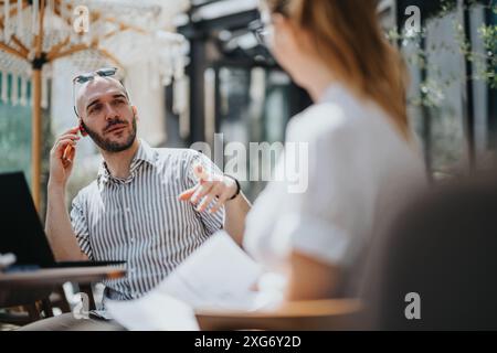 Startup team in business meeting discussing strategy in outdoor setting Stock Photo