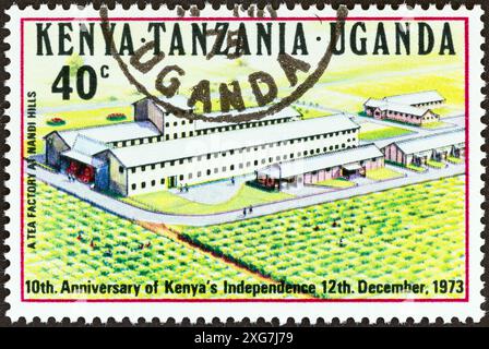 KENYA UGANDA TANGANYIKA - CIRCA 1973: A stamp printed in Kenya Uganda Tanganyika shows Tea Factory at Nandi Hills Stock Photo