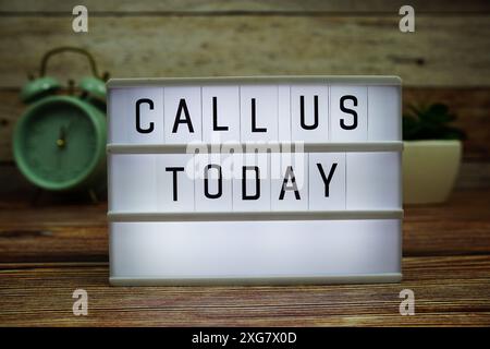 CALL US TODAY letterboard text on LED Lightbox on wooden background, Business and Communication concept background Stock Photo