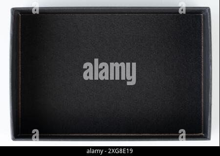 Black paper box above top view isolated on white studio background Stock Photo