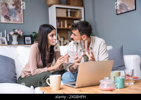 Successful young business people working together in home office. Couple teamwork startup concept video call presentation on laptop computer and webca Stock Photo