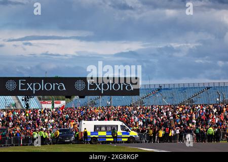 Silverstone, UK. 07th July, 2024. Circuit atmosphere - fans on the circuit. Formula 1 World Championship, Rd 12, British Grand Prix, Sunday 7th July 2024. Silverstone, England. Credit: James Moy/Alamy Live News Stock Photo