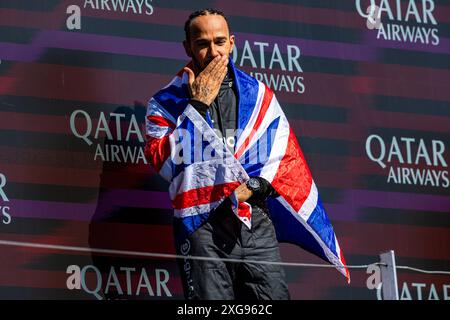Silverstone, UK. 07th July, 2024. Lewis Hamilton (GBR) - Mercedes-AMG PETRONAS F1 Team - Mercedes W15 - Mercedes E Performance on the podium after winning the Race on day 4, Sunday july 7, 2024 of the formula 1 qatar airways british grand prix 2024, scheduled to take place at the silverstone circuit from july 5 to july 7, 2024 Credit: Alessio De Marco/Alamy Live News Stock Photo