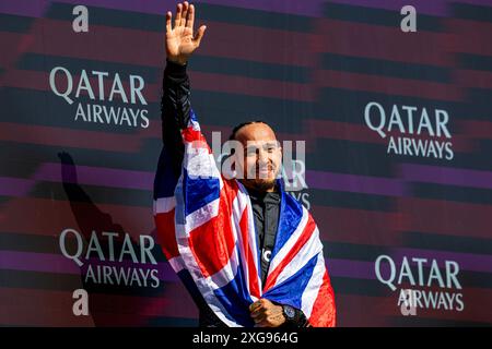 Silverstone, UK. 07th July, 2024. Lewis Hamilton (GBR) - Mercedes-AMG PETRONAS F1 Team - Mercedes W15 - Mercedes E Performance on the podium after winning the Race on day 4, Sunday july 7, 2024 of the formula 1 qatar airways british grand prix 2024, scheduled to take place at the silverstone circuit from july 5 to july 7, 2024 Credit: Alessio De Marco/Alamy Live News Stock Photo