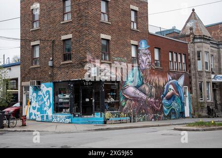 The Lumberjack and the Lynx mural on Rachel Street East in downtown Montreal, Quebec, Canada Stock Photo