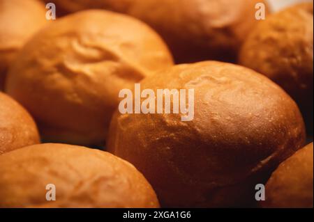 Cheeseburger or hamburger buns. Freshly baked buns are on the tray Stock Photo