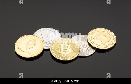 Cryptocurrency coins on dark background. Blockchain money Stock Photo