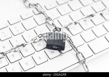 Computer Security concept. Chain and padlock on keyboard. Cyber security concept Stock Photo