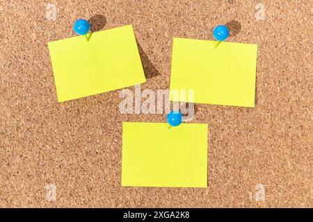 Group of Yellow sticky notes on a cork board for adding text. Template Mock up Stock Photo