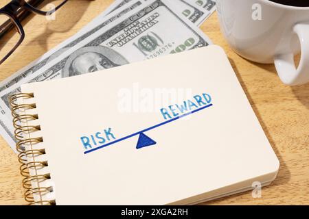 Risk reward concept. Drawing on notepad on desk Stock Photo
