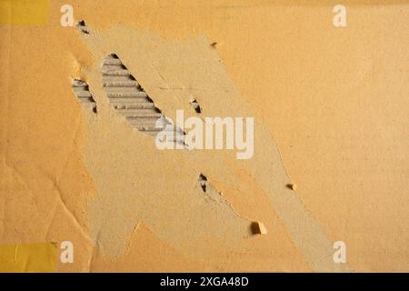 A worn damaged cardboard texture background Stock Photo