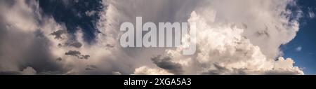 Dramatic sky, light from heaven. (Cumulus) stormy clouds in summer. Background Stock Photo