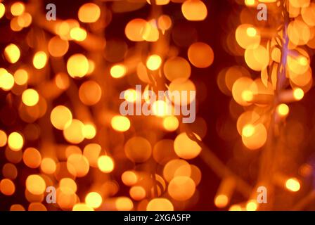 Golden blurry lights of Christmas garland for festive background Stock Photo