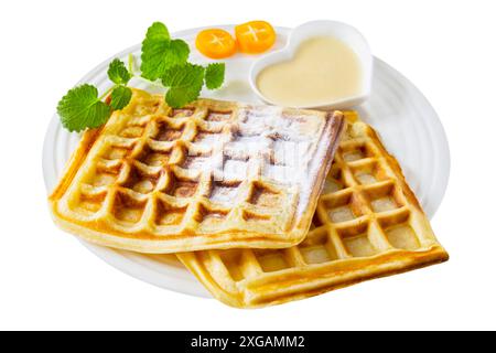 Baked wafers with vanilla sauce isolated on white background  Waffles Stock Photo