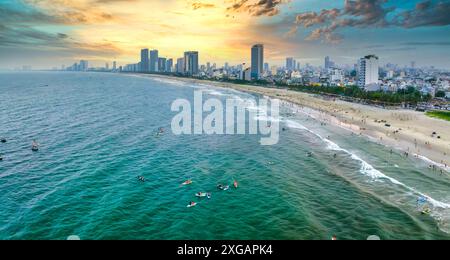 Da Nang, Vietnam - April 15th, 2024: Aerial view of Da Nang beach, Vietnam at sunset sky which is one of the most beautiful beach in the world. Stock Photo