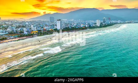 Da Nang, Vietnam - April 15th, 2024: Aerial view of Da Nang beach, Vietnam at sunset sky which is one of the most beautiful beach in the world. Stock Photo