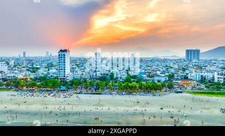 Da Nang, Vietnam - April 15th, 2024: Aerial view of Da Nang beach, Vietnam at sunset sky which is one of the most beautiful beach in the world. Stock Photo